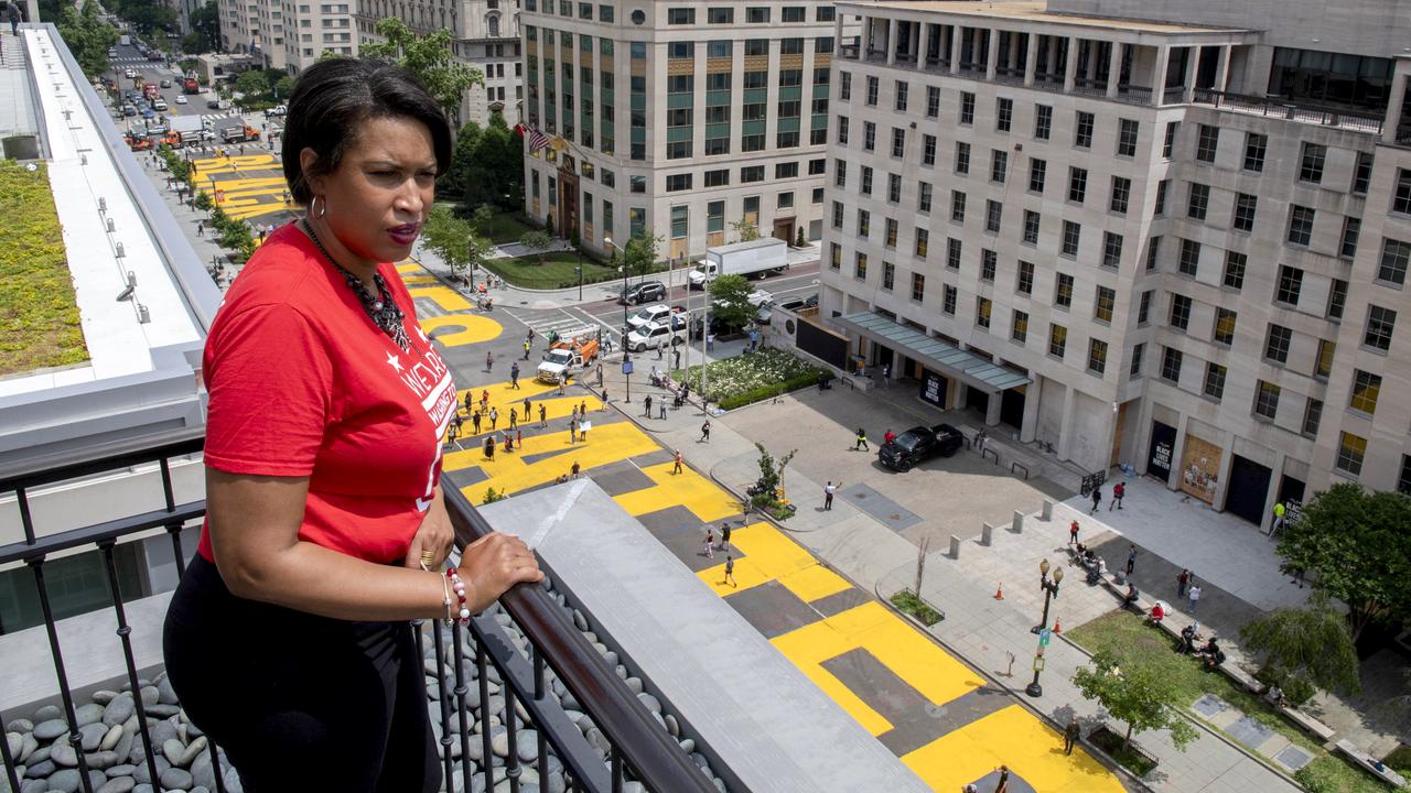 Ms Bowser looking down on the street. You can see the mural, which is about two blocks long. Picture: Khalid Naji-Allah/Mayor’s office via AP