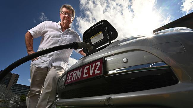 Energy billionaire Trevor St Baker recharges his Nissan Leaf electric vehicle. Picture: Lyndon Mechielsen