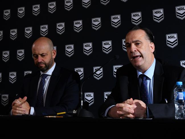 NRL CEO Todd Greenberg (left) and ARLC Chairman Peter V'landys speak to the media in Sydney, Sunday, March 15, 2020. (AAP Image/Joel Carrett) NO ARCHIVING