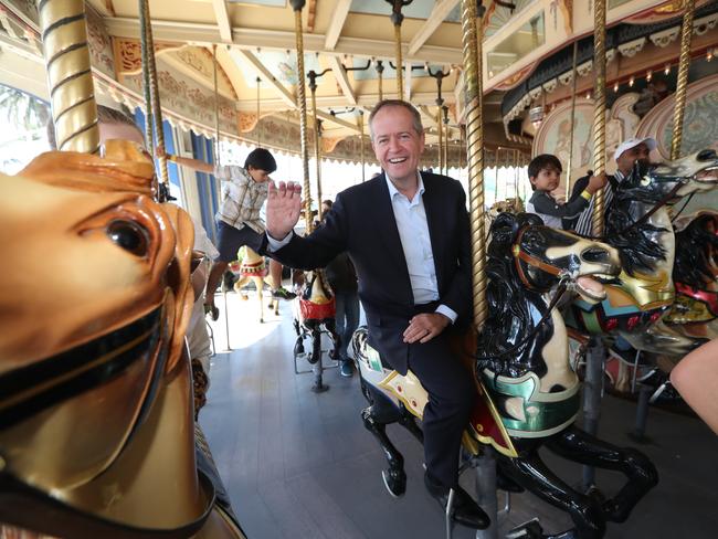 Opposition Leader Bill Shorten rides the carousel at Luna Park in Melbourne. Picture: Kym Smith