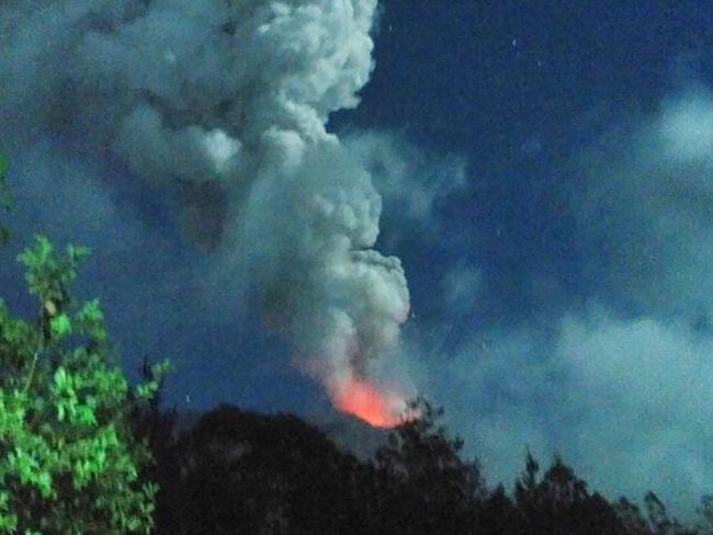 Lava is seen spilling over from Moutn Agung. Picture: AFP