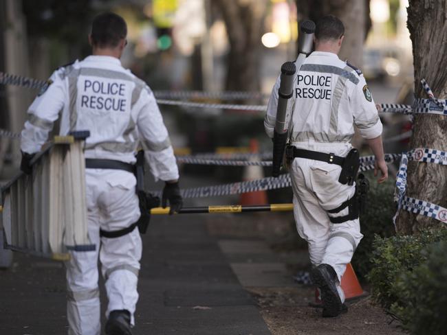 Police collecting items at the Surry Hills property. Picture: Darren Leigh Roberts