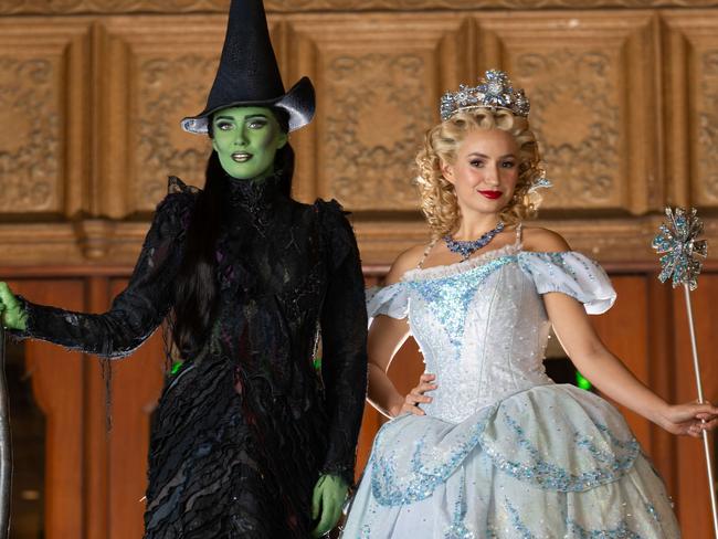 Wicked leads, Elphaba (Green witch) and Sheridan Adams (Glinda) Courtney Monsma costume on Collins street, Melbourne. Picture: Tony Gough