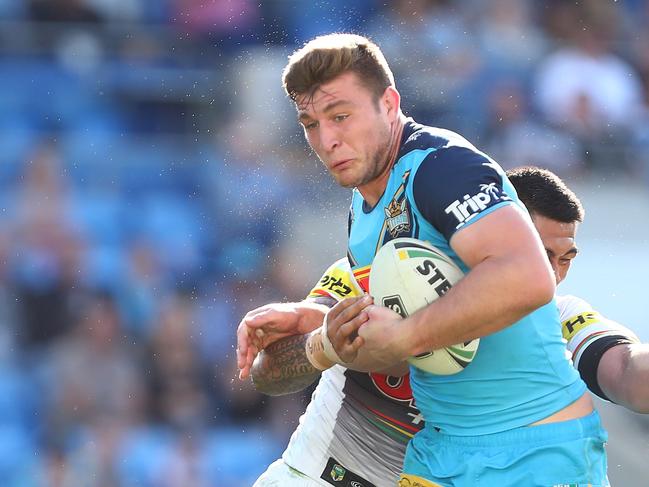 GOLD COAST, AUSTRALIA - AUGUST 11: Jai Arrow of the Titans is tackeld during the round 22 NRL match between the Gold Coast Titans and the Penrith Panthers at Cbus Super Stadium on August 11, 2018 in Gold Coast, Australia. Picture: Chris Hyde/Getty Images