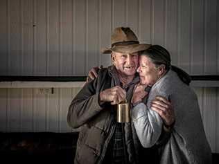 RINGING OUT: Ross McLeod and partner Sheila Moore have a cuddle as they pack up Ross's  bell collection . Picture: Adam Hourigan