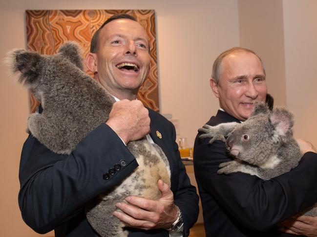 In this photo released by G20 Australia and taken on Saturday Nov 15, 2014, Prime Minister of Australia Tony Abbott and President of Russia Vladimir Putin hold koala's during a photo opportunity on the sidelines of the G-20 summit in Brisbane, Australia. (AP Photo/G20 Australia,Andrew Taylor)