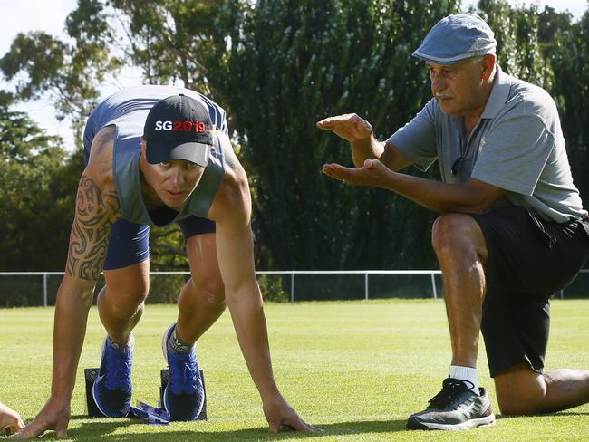 Athlete Luke Whitney with coach Ray Quarrell. Picture: MATT THOMPSON