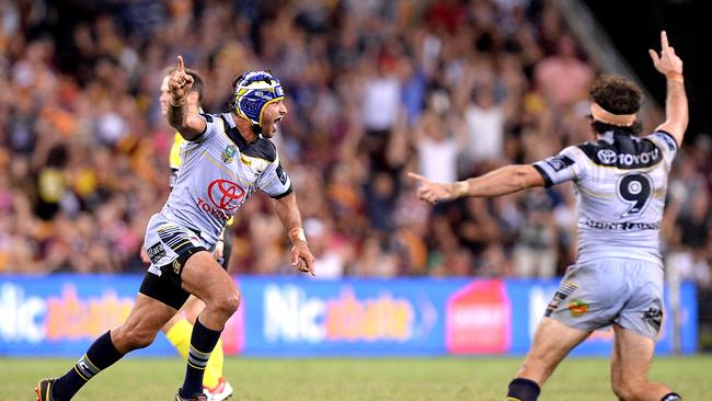 Johnathan Thurston of the Cowboys celebrates victory after kicking the field goal to snatch victory in extra time during the round two NRL match between the Brisbane Broncos and the North Queensland Cowboys at Suncorp Stadium on March 10, 2017 in Brisbane, Australia. (Photo by Bradley Kanaris/Getty Images)