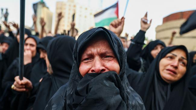 Women cry as people gather at Valiasr Square in Tehran to mourn the death of President Ebrahim Raisi and Foreign Minister Hossein Amir-Abdollahian in a helicopter crash. Picture: AFP