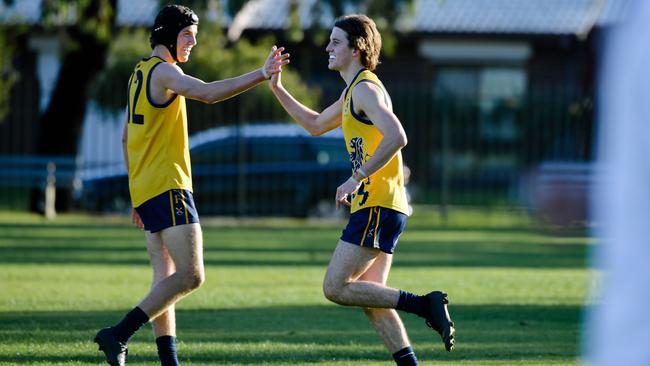 Hugo Walter and Blake Higgins high-fiving after a goal during Scotch’s win over St Michael’s. Picture: AAP/Morgan Sette