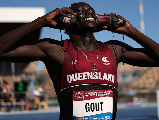 BRISBANE, AUSTRALIA - DECEMBER 06: Gout Gout of Queensland celebrates winning the Boys' U18 100m final during the 2024 Chemist Warehouse Australian All Schools Athletics Championship at Queensland Sport and Athletics Centre on December 06, 2024 in Brisbane, Australia. (Photo by Cameron Spencer/Getty Images)