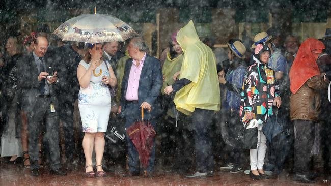 Crowds are hiding from the saturating rain. Picture: Alex Coppel