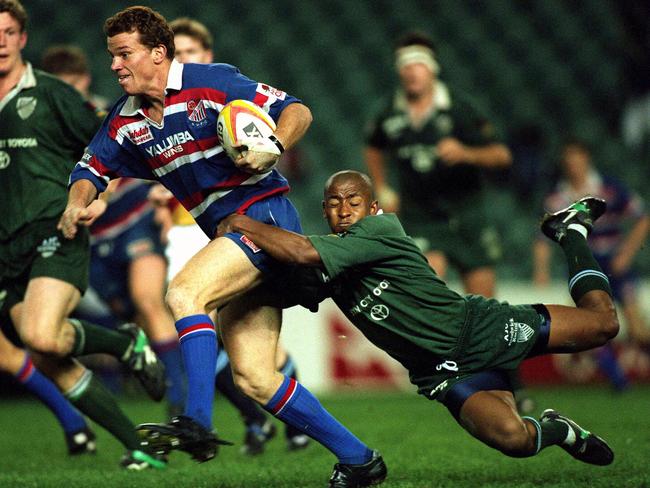 George Gregan brings down Easts’ Ben Farley during his playing days at Randwick.