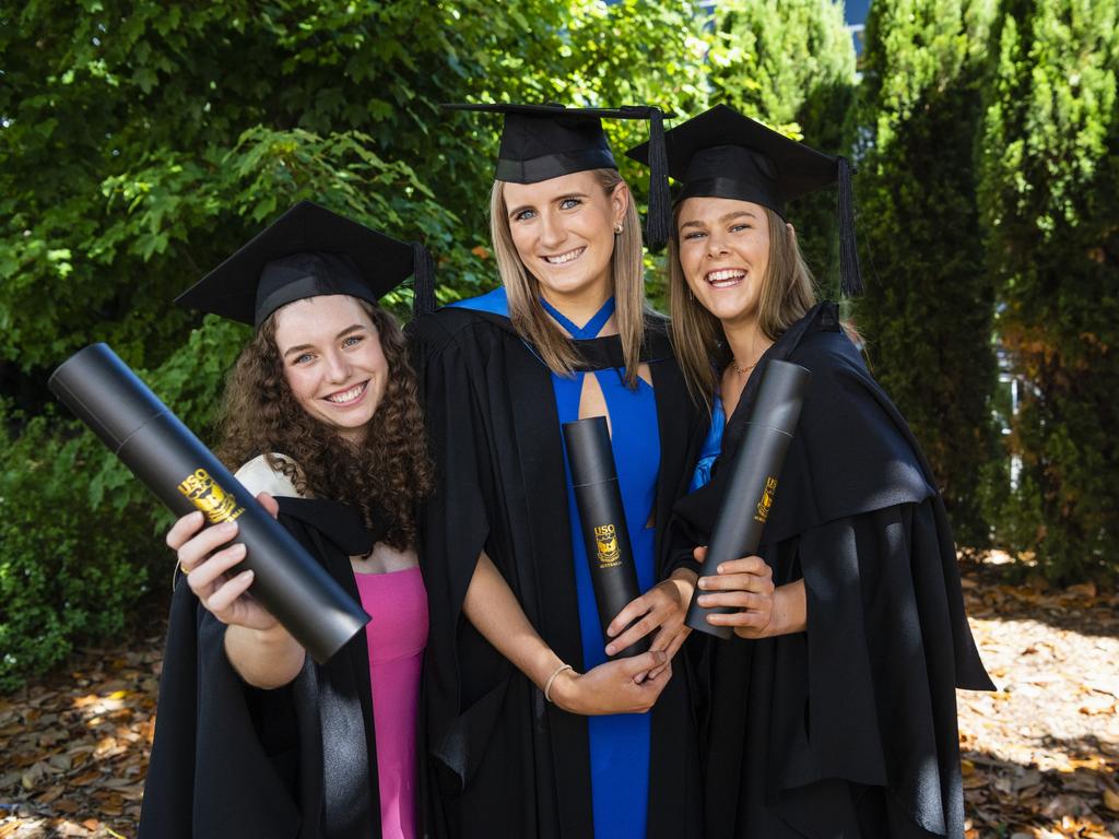 Good friends (from left) Lily Ryan (Bachelor of Communication and Media), Paris Pola (Bachelor of Nursing) and Bec Ryan (Bachelor of Nursing) celebrate graduating together at the UniSQ graduation ceremony at Empire Theatres, Wednesday, December 14, 2022.