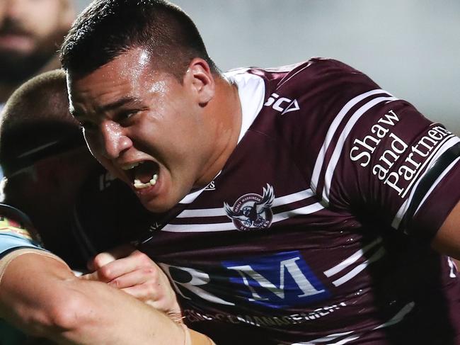 Lloyd Perrett of the Sea Eagles is tackled by the Sharks defence during the First NRL Elimination Final between the Manly Sea Eagles and the Cronulla Sharks at Lottoland in Sydney, Saturday, September 14, 2019. (AAP Image/Brendon Thorne) NO ARCHIVING, EDITORIAL USE ONLY