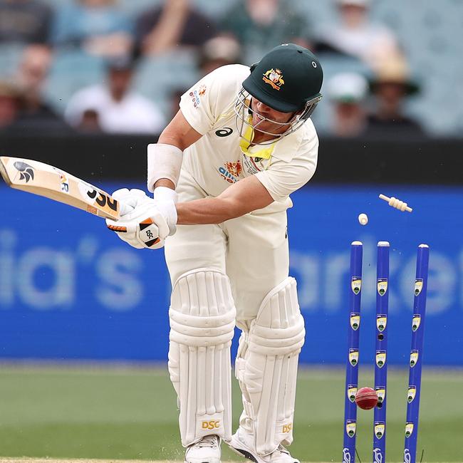 David Warner is knocked over by Anrich Nortje on day three. Picture by Michael Klein