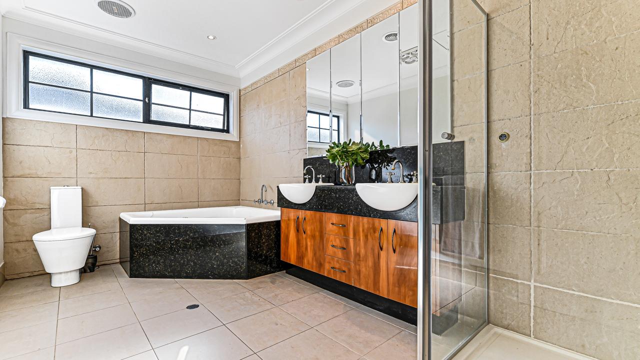 The main bathroom includes a jet spa bathtub.