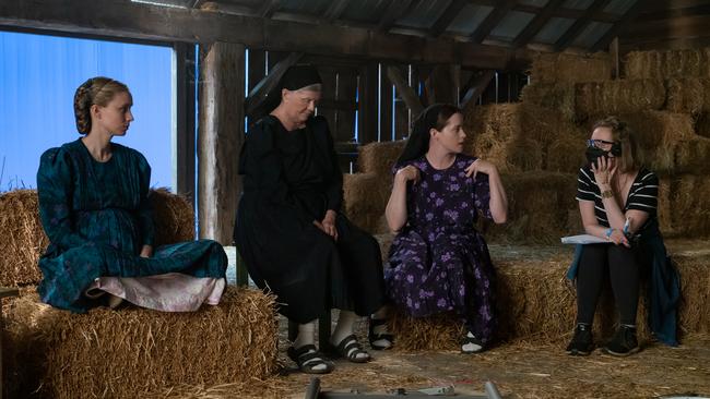 Actors Rooney Mara, Judith Ivey, Claire Foy and director Sarah Polley on the set of the film Women Talking. Picture: Michael Gibson