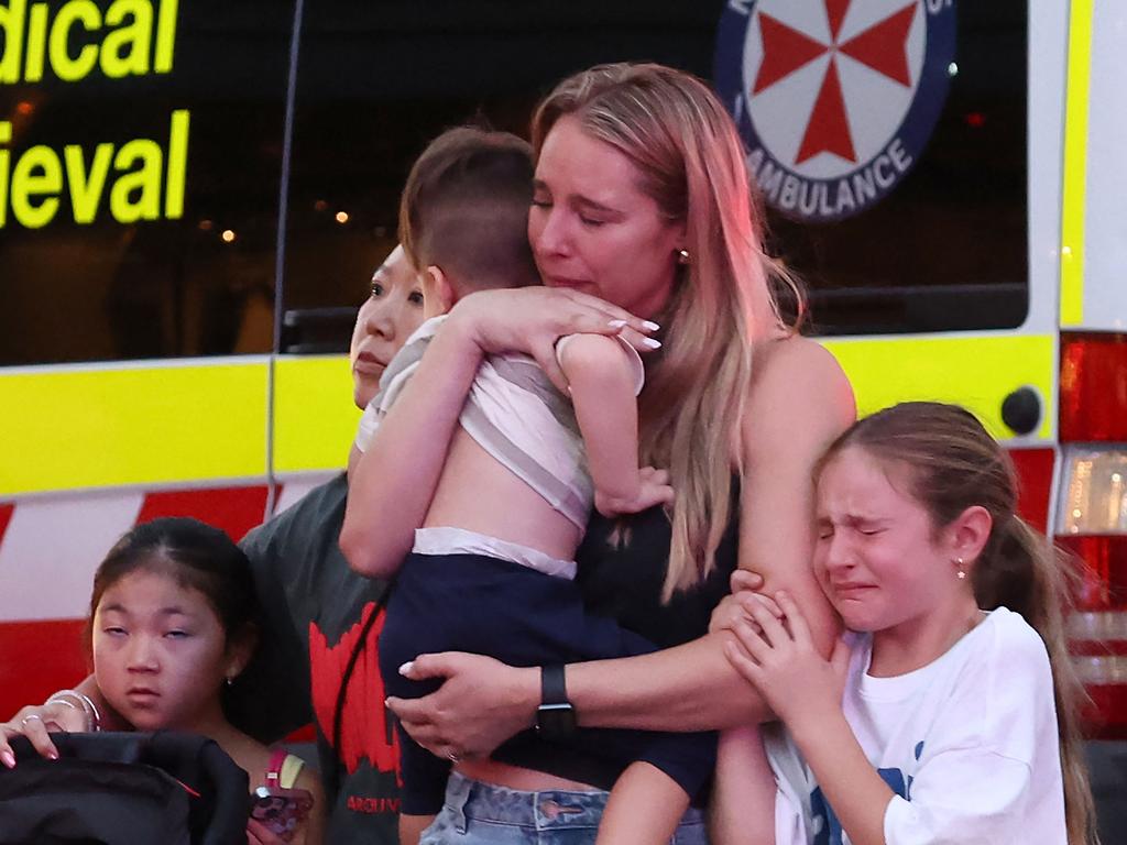 A family leaves the Westfield Bondi Junction. Picture: David GRAY / AFP