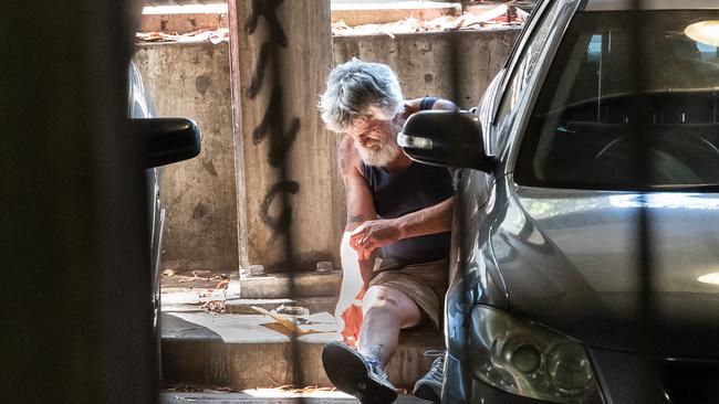 A man injects in car park next to the Richmond safe injecting room. Picture: Jason Edwards