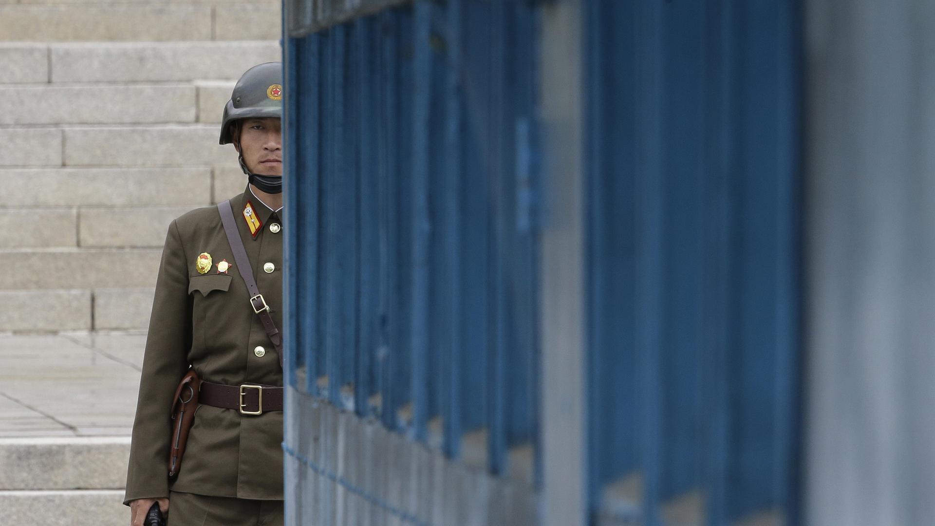 A North Korean army soldier looks at the South side during Australian Defense Minister Marise Payne and Foreign Minister Julie Bishop's visit to the border village of Panmunjom in Paju, South Korea, Thursday, Oct. 12, 2017. (AP Photo/Ahn Young-joon)