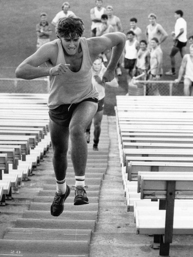 Inaugural Adelaide Crow David Pittman running up stairs at Football Park in 1991. 