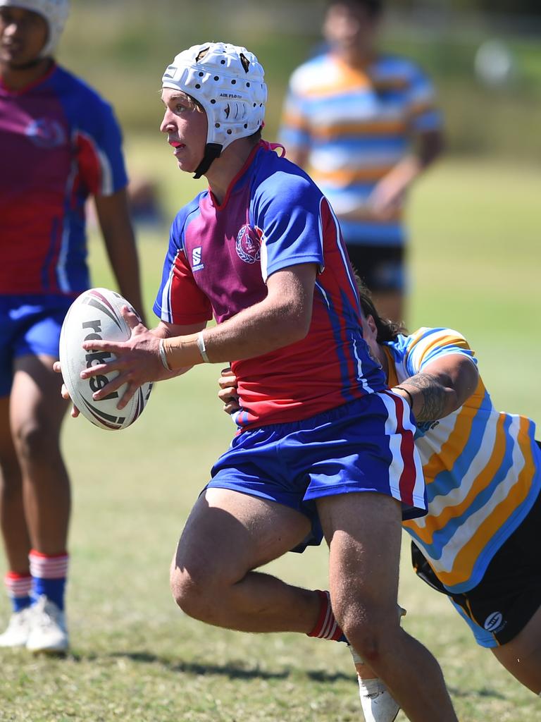 Boys Rugby League State Championship held at Northern Division, Brothers Leagues ground, Townsville. 16-18 years. Peninsula (stripe) v Darling Downs (blue/purple). Braithen Scott of St Mary's College, Toowoomba.