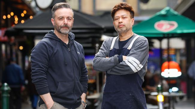 Degraves St traders Theo and Johnny Sandish say traders deserve answers. Picture: Brendan Beckett