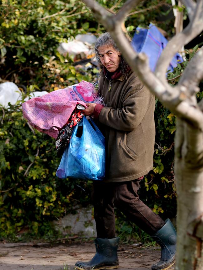 Mary Bobolas, collecting rubbish, says ‘when I have stress I go out and collect things’. Picture: John Grainger