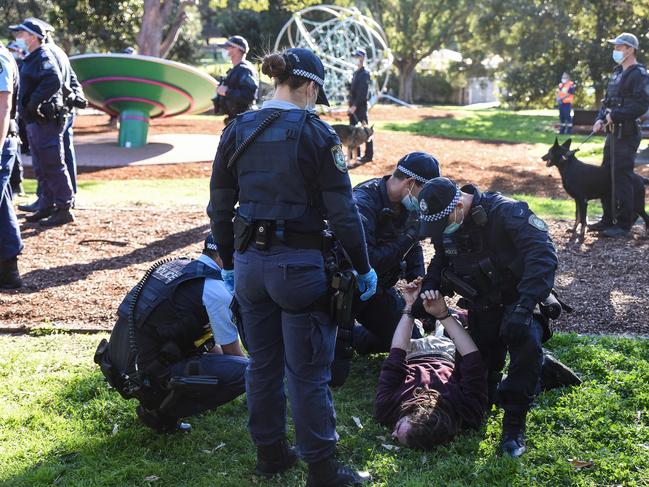 Police detain a protester during the anti-lockdown rally in Sydney. Picture: NCA NewsWire/Flavio Brancaleone