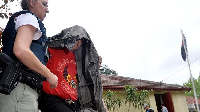 Police arrest a man during the raid on the Hells Angels clubrooms in Fairfield. Picture Nicole Garmston