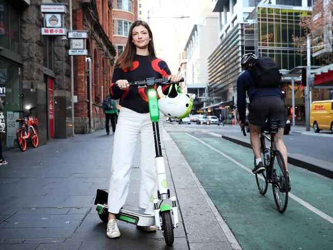 Victoria Read with a Lime E-Scooter which she thinks should be made legal so people can commute to work on them. Picture: Tim Hunter.