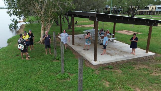 Groper Creek residents enjoy some drinks at the 'Our Front Yard' shelter before heading home to wait out the rising floodwater. Photo: Kat Hampson