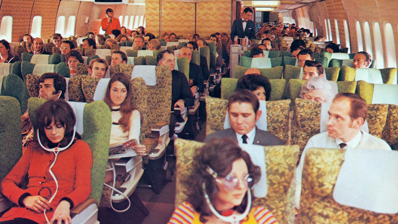 The vibrant 1970s Economy Class cabin of the first Qantas Boeing 747