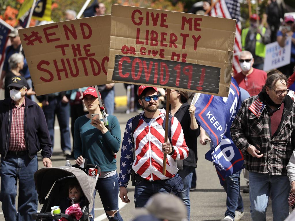 Demonstrators gather at a protest opposing Washington state's stay-home order to slow the coronavirus outbreak. Picture: Elaine Thompson/AP