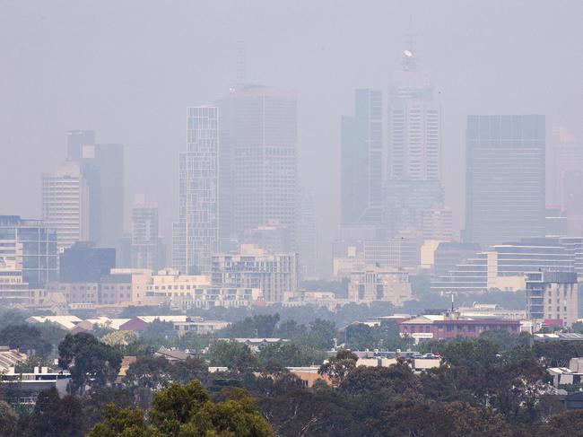 Smoke from bushfires in East Gippsland make the Melbourne Skyline barely visible from Yarra Boulevard, Kew. Picture: Sarah Matray