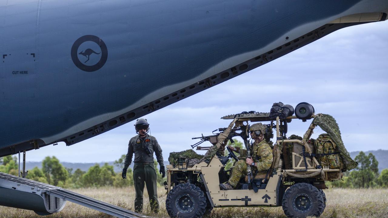 Australian Army soldiers from 2nd Commando Regiment load an all-terrain vehicle onto a Royal Australian Air Force C-27J aircraft at the High Range training area near Townsville, Queensland, during Exercise Talisman Sabre 2019. Picture: Defence