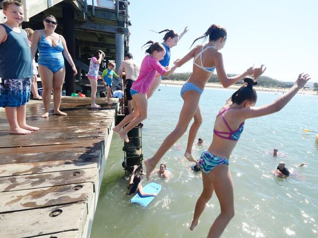 Ciara Barry, Zoe Hilliar, Ailison and Kate Barry take the jump at the Jetty. People out and about in Coffs Harbour on Easter Saturday.Photo: Leigh Jensen / Coffs Coast Advocate