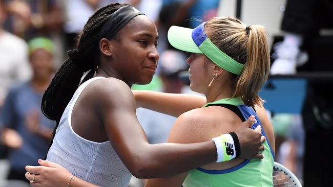 Sofia Kenin hugs Coco Gauff, left, after their women's singles match. Picture: AFP