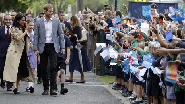 Albert Park Primary School kids line up to wave at the royal couple. Picture: AP