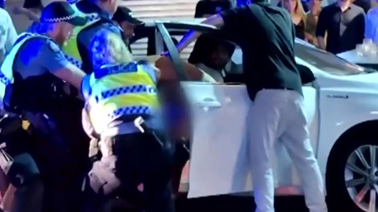 Police officers and members of the public allegedly restrained the accused and pulled him out of a car before he was Tasered. Picture: Supplied / Channel 7