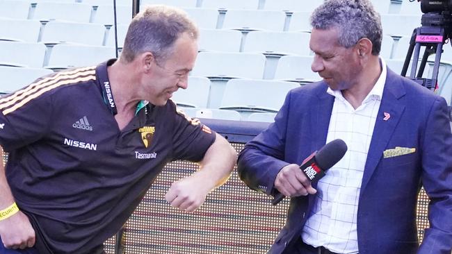 Hawks head coach Alastair Clarkson meets First Nations broadcaster Gilbert McAdam. Picture: AAP Image