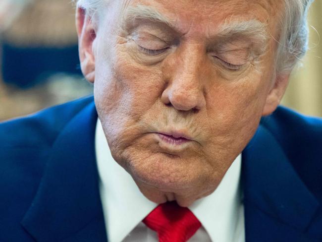 TOPSHOT - US President Donald Trump speaks after signing an executive order in the Oval Office of the White House on April 9, 2025 in Washington, DC. (Photo by SAUL LOEB / AFP)