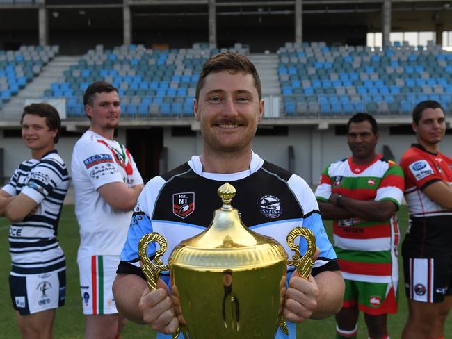 Northern Sharks Jacob Collie holds the NRL NT A-grade premiership cup ahead of the 2022 season. He is flanked by Darwin Brothers’ Isaac Seden-Kurnoth, Nightcliff’s Zakery Mott, South Darwin’s Allan May and Litchfield’s David Jacobson. Picture: (A)manda Parkinson