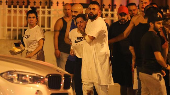 Dramatic scenes as Maghnie’s wounded son returned from hospital on the night of the shooting. Picture: Wayne Taylor.