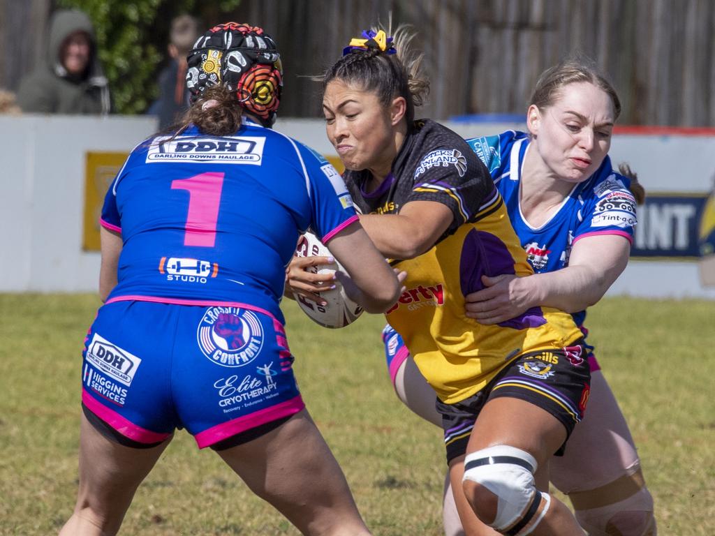 Natalia Webb for Gatton tackled Newtown players. Picture: Nev Madsen.