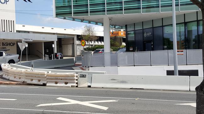 The barricade of plastic and concrete bollards outside the AFP building. Photo: Kristy Muir