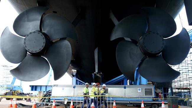 Propellers on the Hobart seen here dwarfing workers. The vessel will be launched on Saturday. Picture: CALUM ROBERTSON