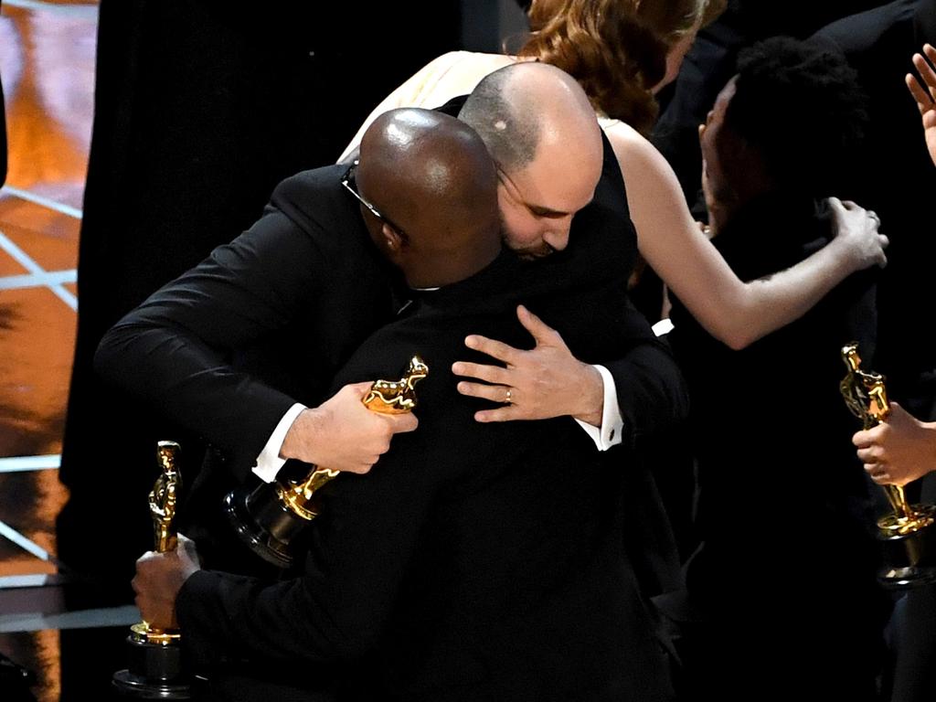 ‘’La La Land’ producer Jordan Horowitz hands over the Best Picture award to ‘Moonlight’ writer/director Barry Jenkins following a presentation error onstage during the 89th Annual Academy Awards. Picture: AFP