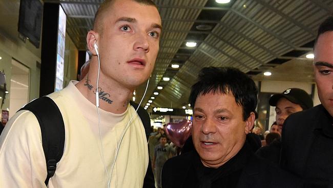 Dustin Martin with manager Ralph Carr after he returned to Melbourne from New Zealand. Picture: Jay Town